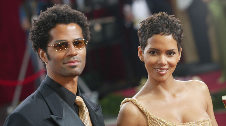 Eric Benét and Halle Berry posing at event