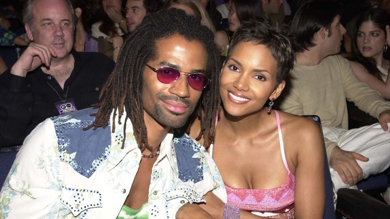 Eric Benét and Halle Berry smiling at event