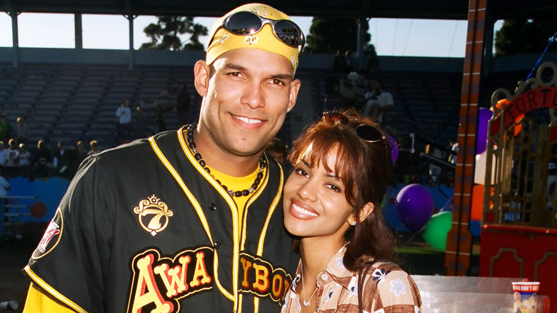 David Justice and Halle Berry smiling at event