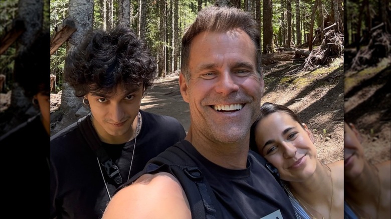 Lucas Mathison looking serious while Cameron Mathison and Leila Mathison smile together