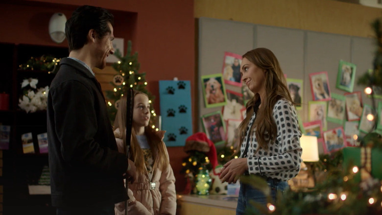 Hallmark's "My Christmas Guide," starring Amber Marshall as Peyton Lewis, Ben Mehl as Trevor Donovan, and Ava Weiss as Annie Donovan.