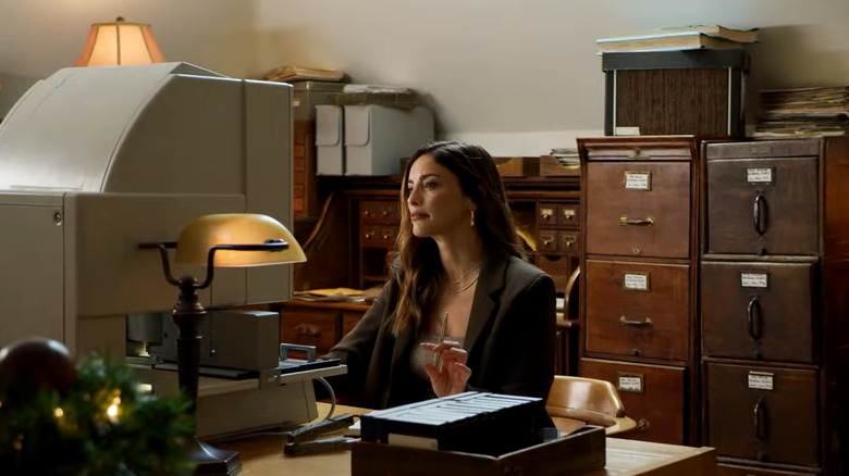 Still from Hallmark Mystery movie "Mystery on Mistletoe Lane," starring Erica Cerra.
