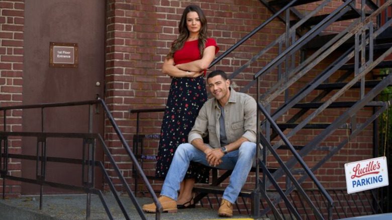 Kimberley Sustad as Kaitlin (left) and Jesse Metcalfe as Derrick (right) posing for promotional photo for "Absolutely Devoted To You."