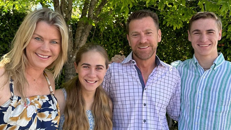 Alison Sweeney posing with her family