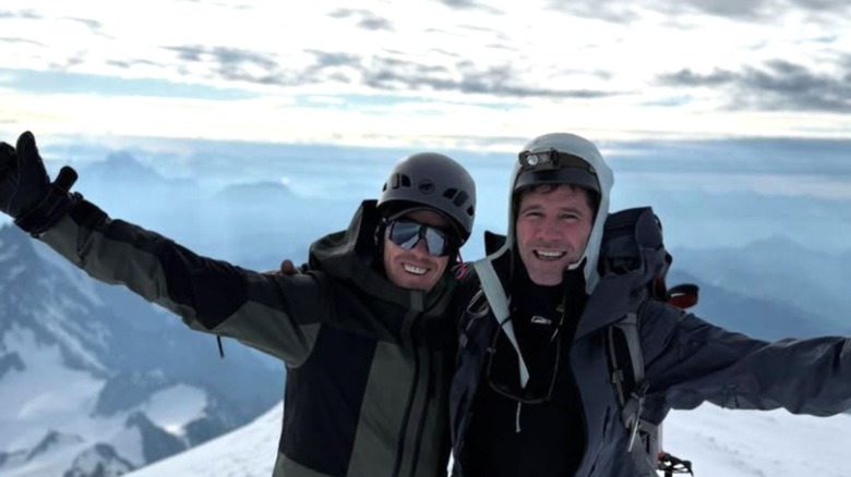Luke Macfarlane and Hig Roberts posing on a mountain