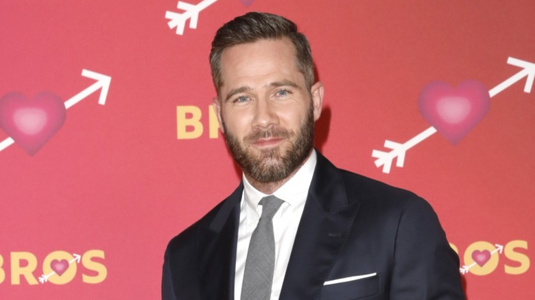 Luke Macfarlane posing on the red carpet