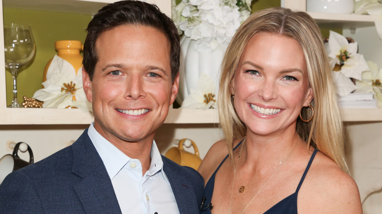 Scott Wolf and Kelley Wolf smiling at an event
