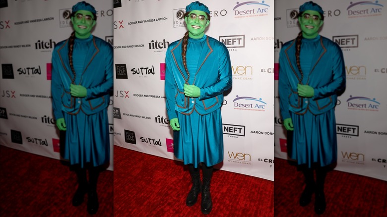 Jonathan Bennett dressed like Elphaba in her school uniform.