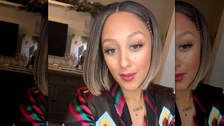Tamara Mowry-Housley posing for selfie