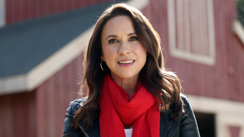 Lacey Chabert photographed in front of a barn