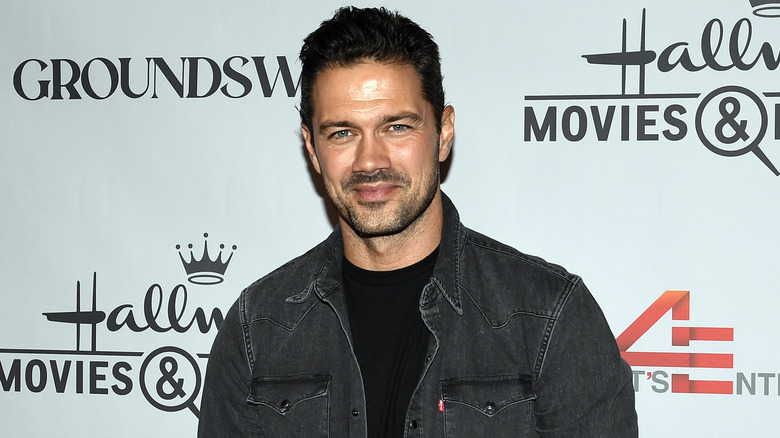 Ryan Paevey smirking