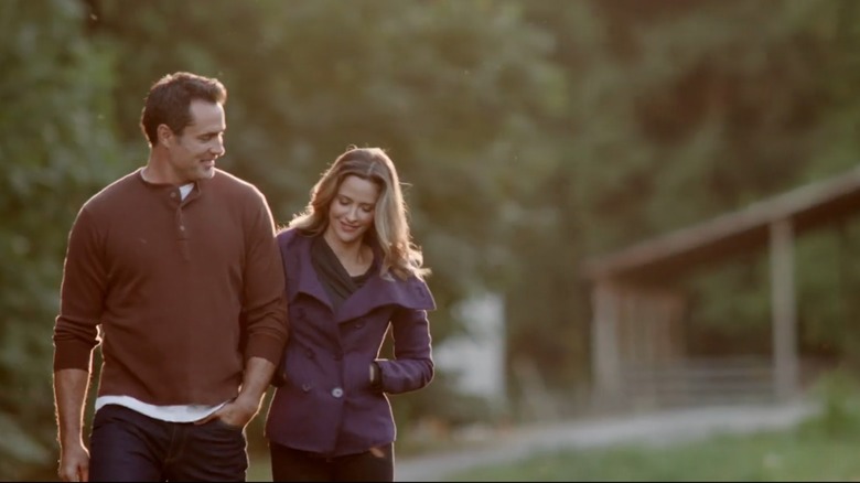 Victor Webster and Jill Wagner walking together