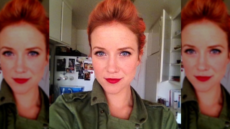 Jessy Schram takes a selfie showing off her red hair.