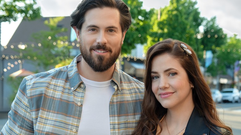 Chris McNally and Julie Gonzalo smiling