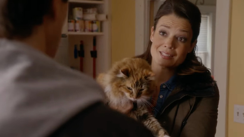 Kimberley Sustad holding a cat in the Nine Lives of Christmas
