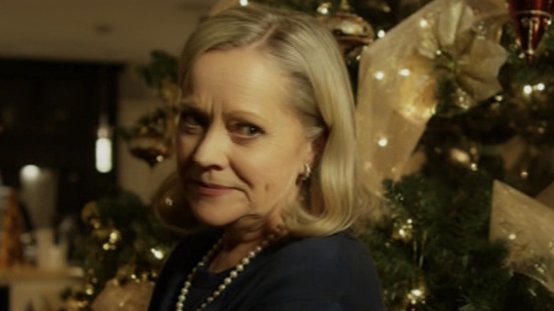 Actor Beverley Breuer standing in front of a Christmas tree in a scene from "A December Bride"