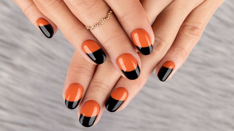 Woman showing off halloween nails