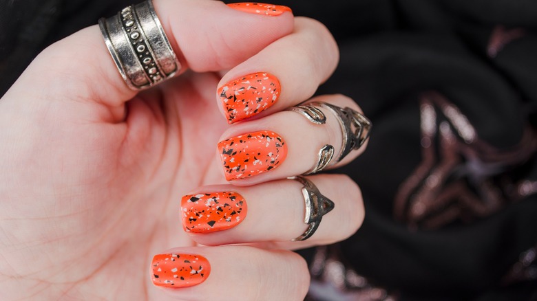 Woman showing off halloween nails