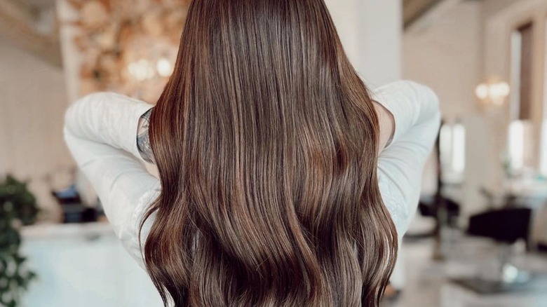 Woman wearing Halo hair extensions