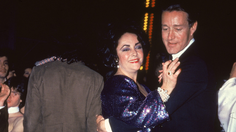Halston dancing with Elizabeth Taylor