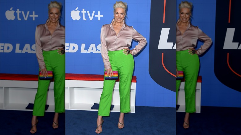 Hannah Wadding wearing green cropped pants and a blush satin shirt.