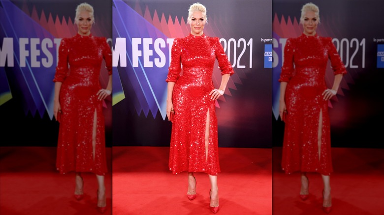 Hannah Waddingham wearing a red sequin midi dress.
