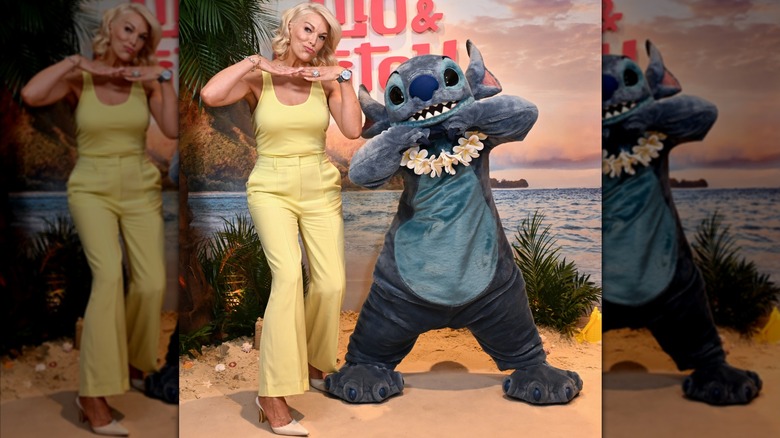 Hannah Waddingham posing with someone in a Stitch costume.