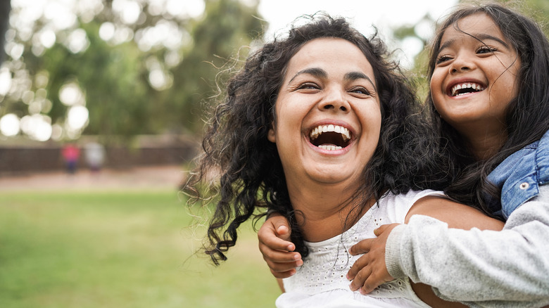 Smiling mother and daughter