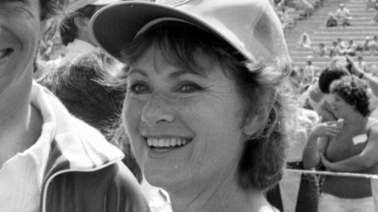 Marion Ross smiling and wearing a baseball cap at an outdoor event in 1979