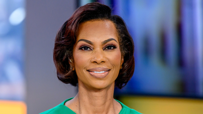 Harris Faulkner smiling in a green dress while on 'Outnumbered.'