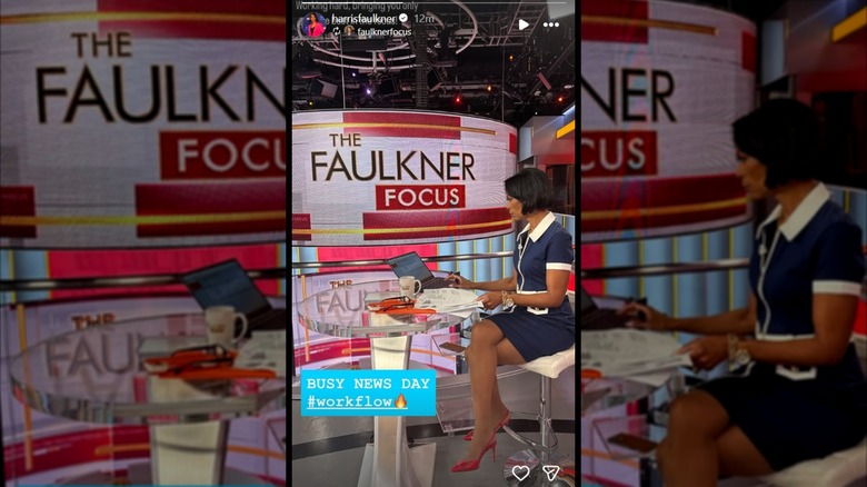 Harris Faulkner sitting at her desk while wearing a blue dress and red high heels.