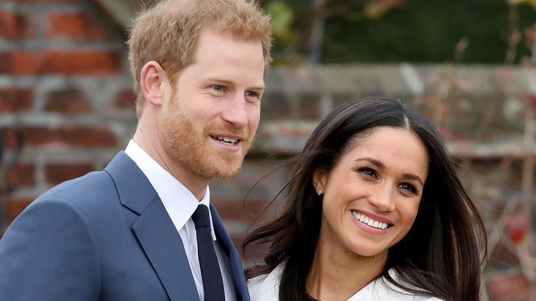 Prince Harry and Meghan Markle smiling