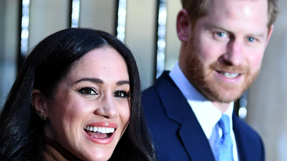 Meghan and Harry smile