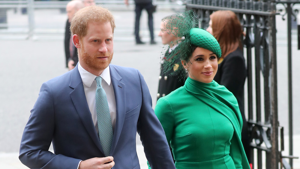 Meghan Markle in green dress with Prince Harry