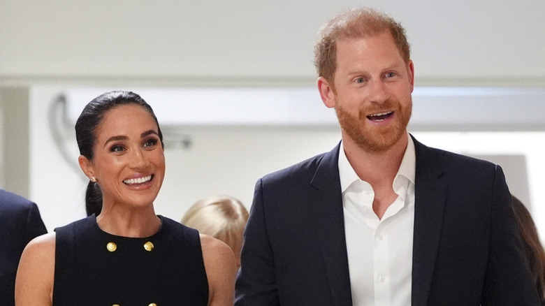 Prince Harry and Meghan Markle smiling