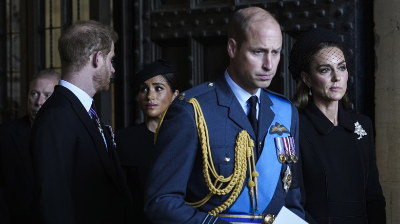 Catherine, Princess of Wales, William, Princes of Wales, Prince Harry, and Meghan Markle at Queen Elizabeth's funeral