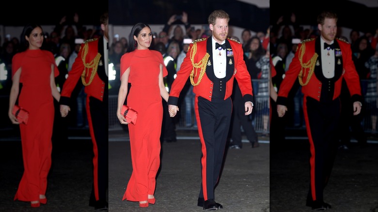 Meghan Markle holding hands with Prince Harry in red and black outfits