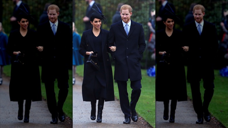Meghan Markle and Prince Harry walk outside at Christmas event in England