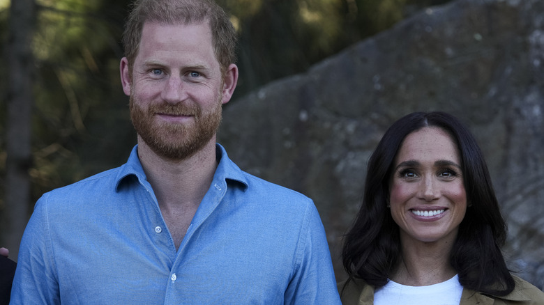 Prince Harry and Meghan Markle smiling