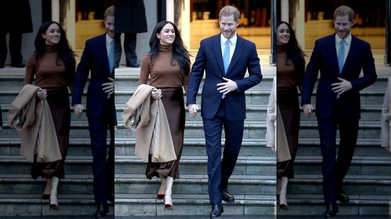 Meghan Markle and Prince Harry walk down a set of stairs