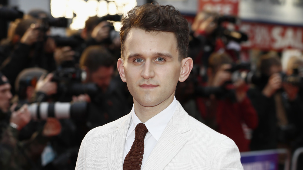 Harry Melling poses on the red carpet