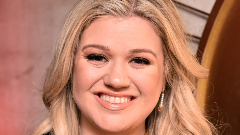 Kelly Clarkson smiling at an event