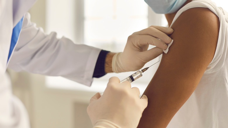 Woman receiving vaccine