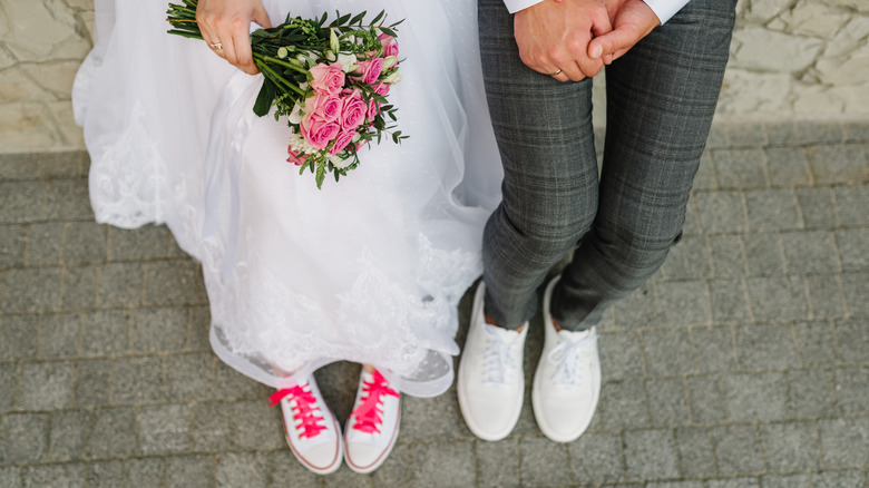 Bride and groom wearing Converse