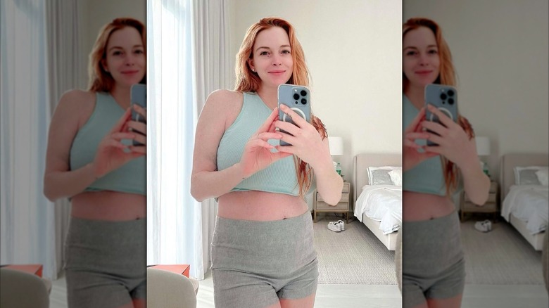 Lindsay Lohan wearing a sports bra and shorts