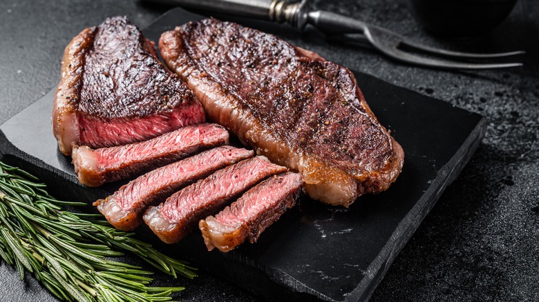 steak cut on board