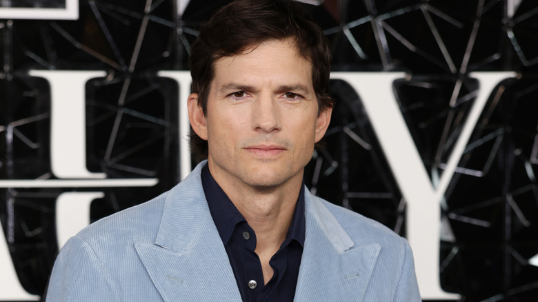 Ashton Kutcher wears a blue suit at "The Beauty" Premiere at Odeon Luxe West End on January 16, 2026 in London, England.