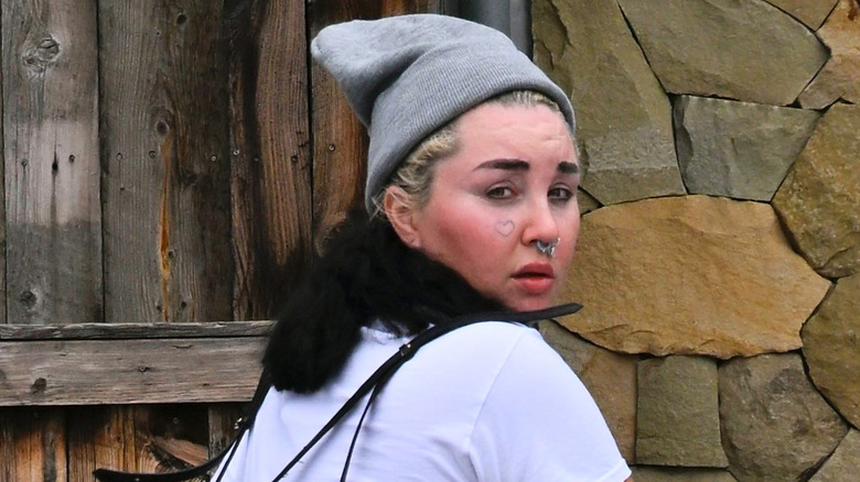 Amanda Bynes looking over her shoulder in August 2025