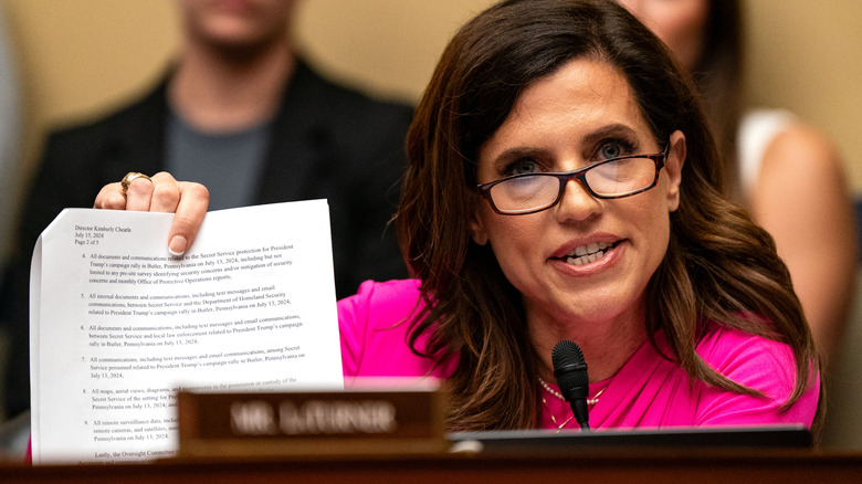 Rep. Nancy Mace speaking while holding up a document