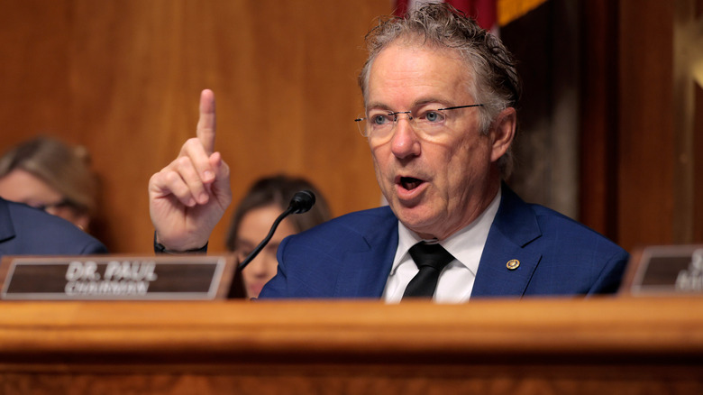 Sen. Rand Paul pointing a finger upwards as he speaks